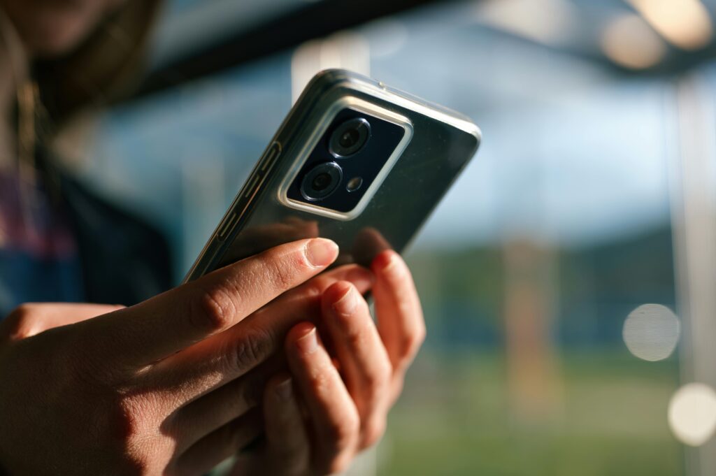 A picture of a persons hands holding a smartphone