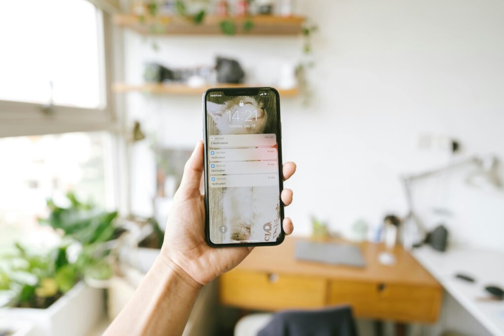 A picture of a mobile phone recieving messages and notifications